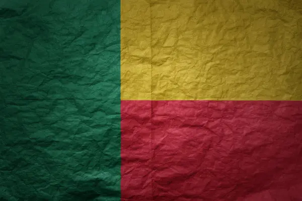 stock image colorful big national flag of benin on a grunge old paper texture background