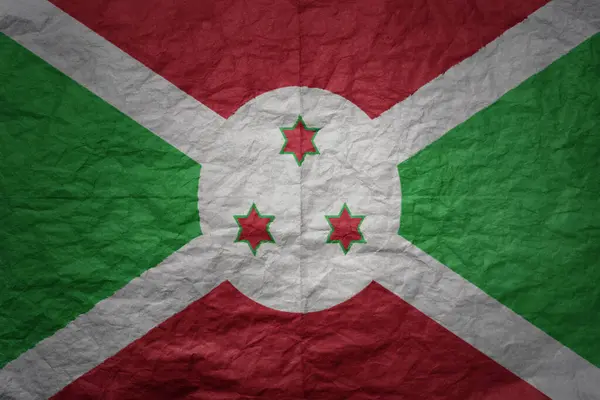 stock image colorful big national flag of burundi on a grunge old paper texture background