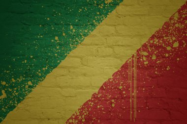 colorful painted big national flag of republic of the congo on a massive old brick wall clipart