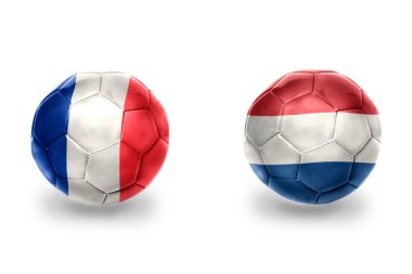 Fransa ve Hollanda ulusal bayraklı gerçekçi futbol topları, futbol takımları. beyaz arkaplanda.