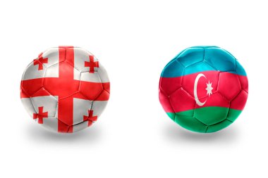 Azerbaijan ve Gürcistan ulusal bayraklı gerçekçi futbol topları, futbol takımları. beyaz arkaplanda.