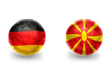 Alman ve Macedonia ulusal bayraklı gerçekçi futbol topları, futbol takımları. beyaz arkaplanda.