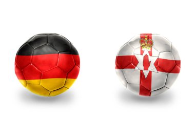 Almanya ve Kuzey İrlanda 'nın ulusal bayraklı gerçekçi futbol topları, futbol takımları. beyaz arkaplanda.