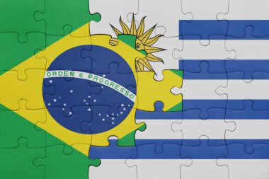 Uruguay 'ın renkli ulusal bayrağı ve Brezilya bayrağı ile bulmaca. konsept