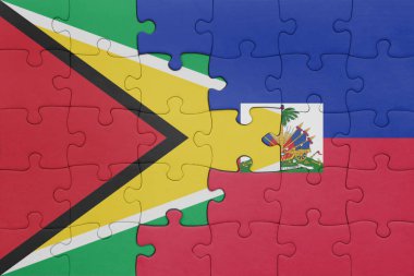 Haiti 'nin renkli ulusal bayrağı ve Guyana bayrağı ile bulmaca. konsept