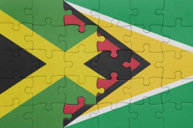 Guyana 'nın renkli ulusal bayrağı ve Jamaika bayrağının bulmacası. konsept
