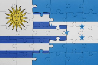 Honduras ve Uruguay bayrağının renkli ulusal bayrağıyla bulmaca. konsept