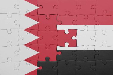 Yemen bayrağı ve Bahreyn bayrağı ile dolu renkli bir yapboz. konsept