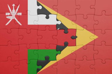 Umman 'ın renkli ulusal bayrağı ve Doğu Timor' un bayrağı. konsept