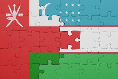 Umman ve Özbekistan bayrağının renkli ulusal bayrağıyla bulmaca. konsept
