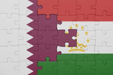 Katar 'ın renkli ulusal bayrağı ve Tacikistan bayrağı bulmacası. konsept