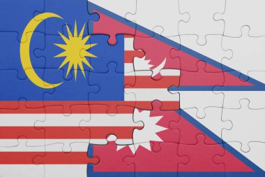 Nepal ve Malezya bayrağının renkli ulusal bayrağıyla bulmaca. konsept