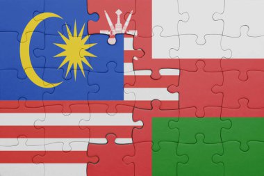 Umman 'ın renkli ulusal bayrağı ve Malezya bayrağı ile bulmaca. konsept