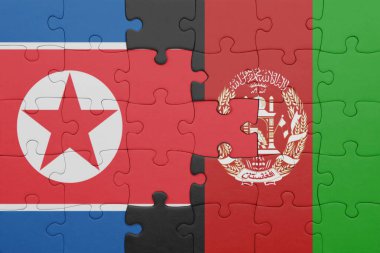 Afganistan 'ın renkli ulusal bayrağı ve Kuzey Kore bayrağının bulmacası. konsept