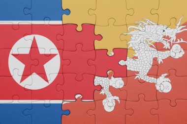Bhutan bayrağı ve Kuzey Kore bayrağı ile dolu renkli bir yapboz. konsept