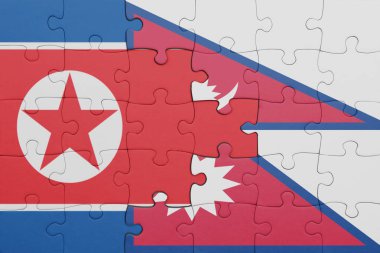 Nepal 'in renkli ulusal bayrağı ve Kuzey Kore bayrağının bulmacası. konsept