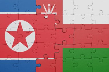 Umman 'ın renkli ulusal bayrağı ve Kuzey Kore bayrağı. konsept