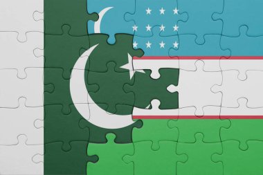 Özbekistan 'ın renkli ulusal bayrağı ve Pakistan bayrağı ile bulmaca. konsept