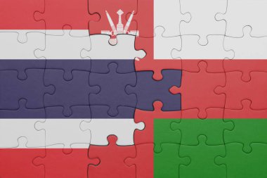 Tayland ve Umman bayrağının renkli ulusal bayrağıyla bulmaca. konsept