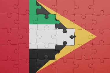 Doğu Timor 'un renkli ulusal bayrağı ve Birleşik Arap Emirliklerinin bayrağı. konsept
