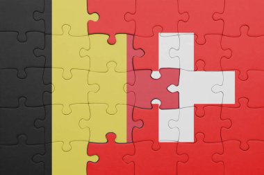İsviçre bayrağı ve Belçika bayrağının rengarenk yapbozu. konsept