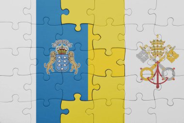 Vatikan şehrinin renkli ulusal bayrağı ve kanarya adalarının bayrağıyla ilgili bulmacalar. konsept