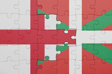 Bask ülkesinin renkli ulusal bayrağı ve İngiltere bayrağının bulmacası. konsept