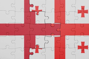 Gürcistan 'ın renkli ulusal bayrağı ve İngiltere bayrağının bulmacası. konsept