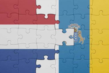 Kanarya adalarının renkli ulusal bayrağı ve Hollanda bayrağıyla ilgili bulmacalar. konsept