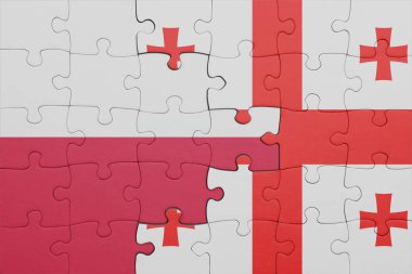Gürcistan 'ın renkli ulusal bayrağı ve Polonya bayrağının bulmacası. konsept