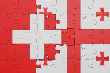 Gürcistan 'ın renkli ulusal bayrağı ve İsviçre bayrağı. konsept