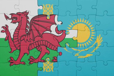 Kazakistan 'ın renkli ulusal bayrağı ve Galler bayrağı ile bulmaca. konsept