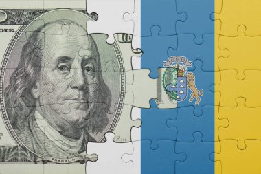 Kanarya adalarının renkli ulusal bayrağı ve Amerikan doları para kavramının bulmacası.