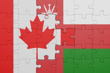 Umman 'ın renkli ulusal bayrağı ve Kanada bayrağı ile bulmaca. konsept