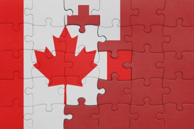 Tonga 'nın renkli ulusal bayrağı ve Kanada bayrağı ile bulmaca. konsept