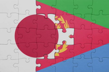 Japon bayrağı ve eritreanın renkli ulusal bayrağıyla bulmaca. konsept