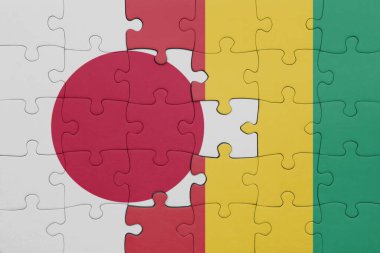 Gine ve Japonya bayrağının renkli ulusal bayrağıyla bulmaca. konsept