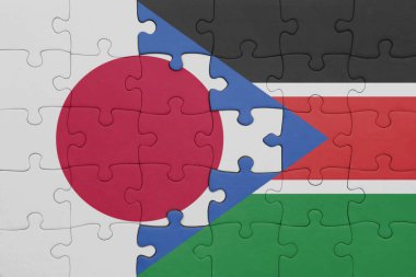 Güney Sudan 'ın renkli ulusal bayrağı ve Japon bayrağı ile bulmaca. konsept