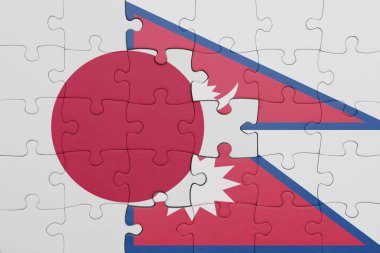 Nepal bayrağı ve Japon bayrağının renkli ulusal bayrağıyla bulmaca. konsept