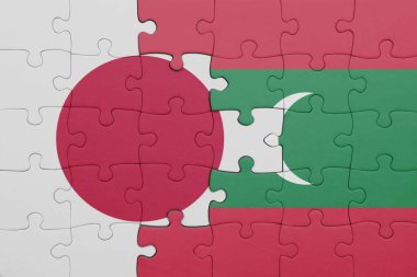 Japon bayrağı ve maldivlerin renkli ulusal bayrağıyla bulmaca. konsept