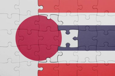 Tayland ve Japonya bayrağının renkli ulusal bayrağıyla bulmaca. konsept