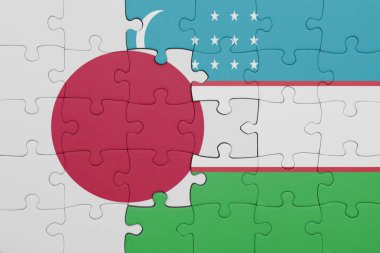 Özbekistan 'ın renkli ulusal bayrağı ve Japon bayrağı ile bulmaca. konsept