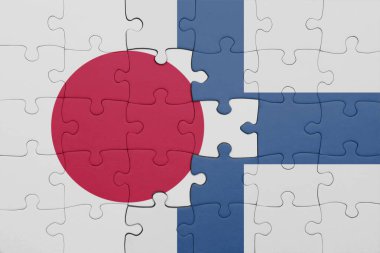 Finlandiya 'nın renkli ulusal bayrağı ve Japonya bayrağı ile bulmaca. konsept