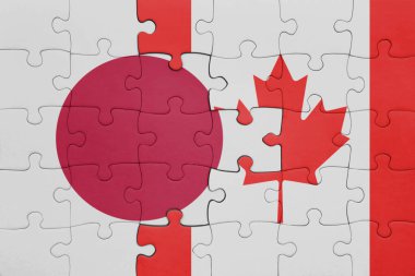 Kanada bayrağı ve Japonya bayrağının rengarenk yapbozu. konsept