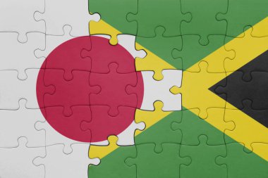 Jamaika 'nın renkli ulusal bayrağı ve Japonya bayrağının bulmacası. konsept