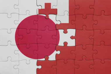 Tonga 'nın renkli ulusal bayrağı ve Japon bayrağı ile bulmaca. konsept