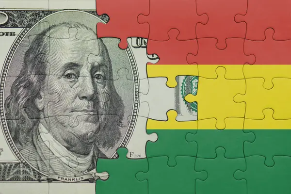Bolivya 'nın renkli ulusal bayrağı ve Amerikan doları para kavramının bulmacası.
