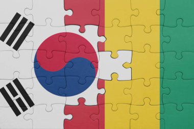 Güney Kore bayrağı ve Gine 'nin renkli ulusal bayrağıyla bulmaca. konsept