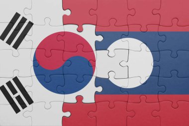 Güney Kore bayrağı ve laoların renkli ulusal bayrağıyla bulmaca. konsept