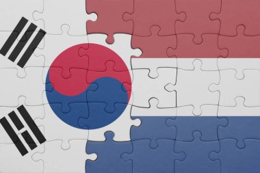 Hollanda 'nın renkli ulusal bayrağı ve Güney Kore bayrağının bulmacası. konsept